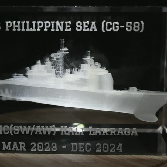 Close-up of personalized ship name, recipient name and dates on a cruiser crystal