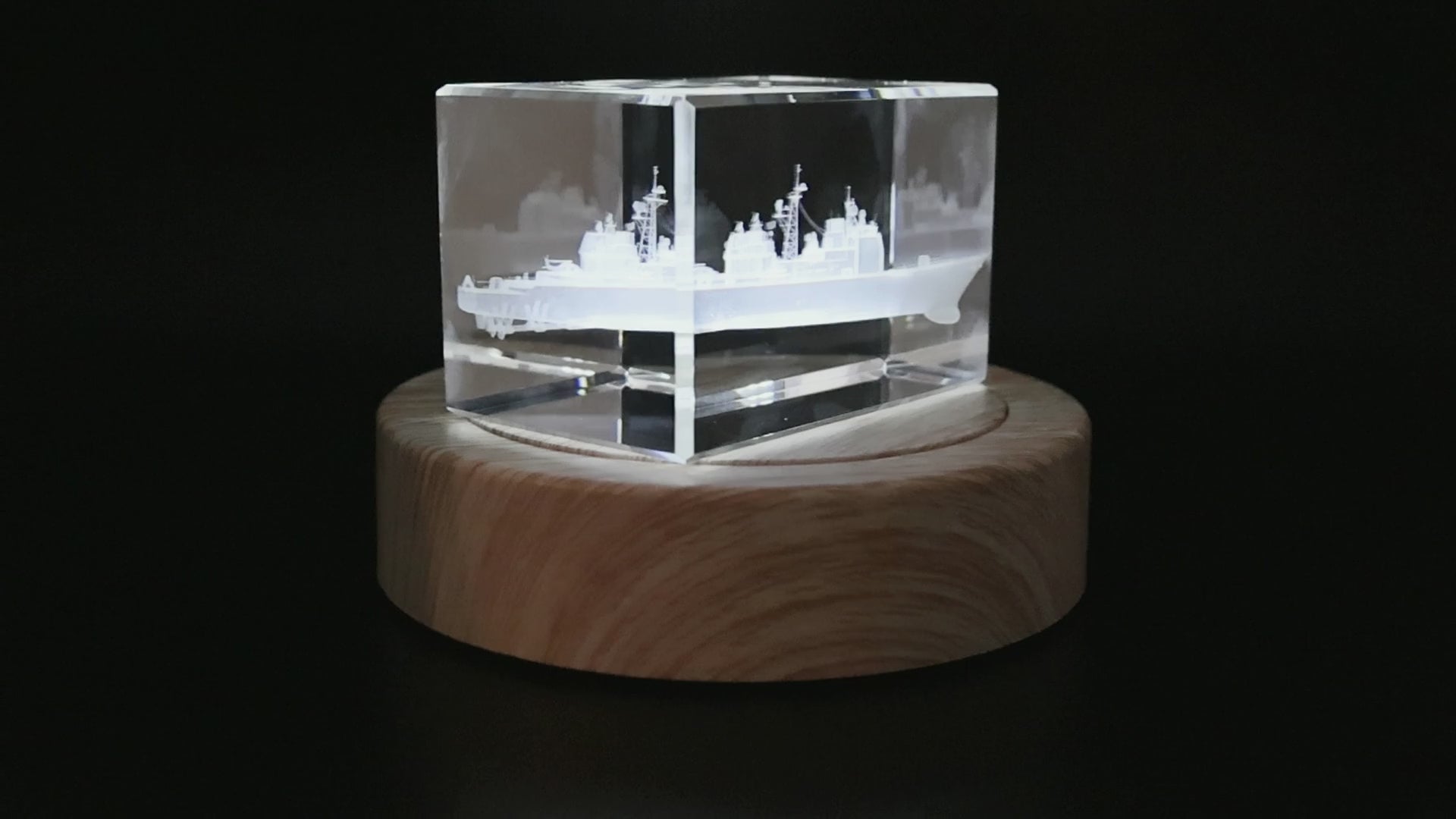 Actual cruiser crystal rotating on its illuminated wood base