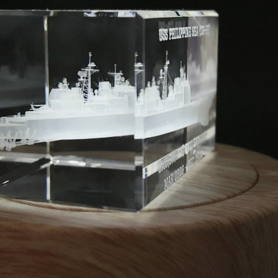 Multiple angles of a Ticonderoga-class cruiser crystal showing optional custom engraving