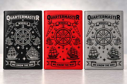 Black, red, and gray Quartermaster refillable notebooks with standard artwork and no name personalization; silver engraving on black and black engraving on red and gray